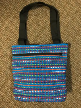 Guatemalan honeycomb weave hand bag with exterior zipper compartment. Approximately 13” x 13”